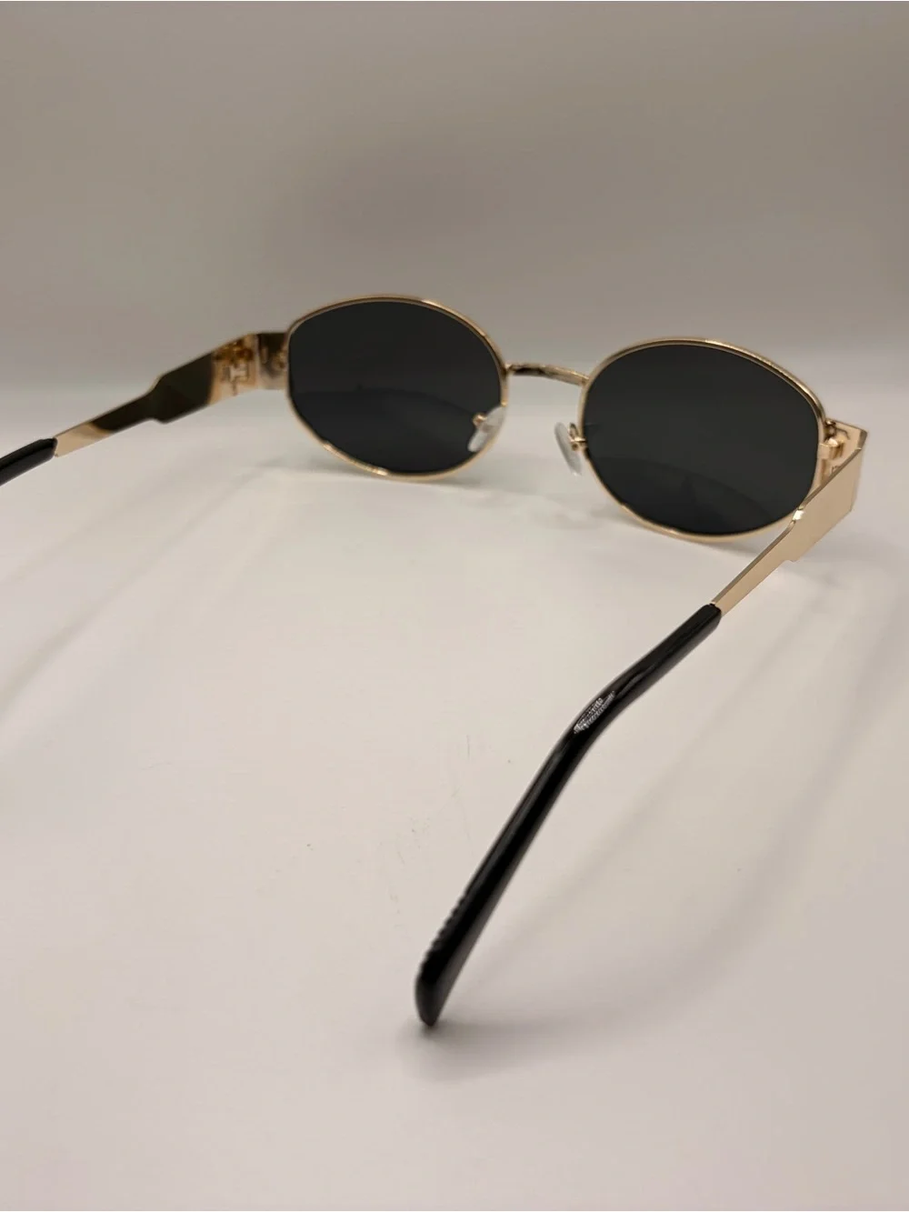 Gold Frame Oval Sunglasses with Dark Lenses